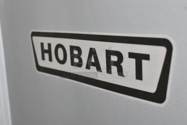 Hobart M802 commercial dough mixer label, black text on silver background, highlights brand authenticity.