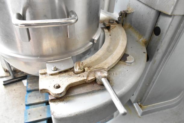 Hobart M802 metal commercial mixer with stainless steel bowl and guard, visible wear on base, includes whisk attachment.
