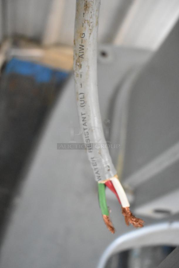 Frayed power cable labeled "Water Resistant (UL)" for a Hobart M802 dough mixer.