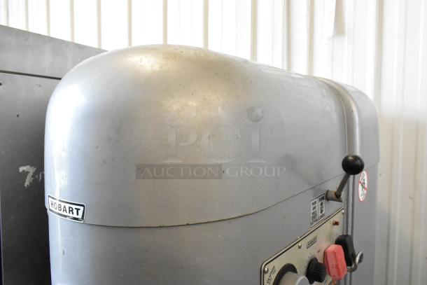 Hobart M802 commercial planetary dough mixer featuring a stainless steel bowl, bowl guard, paddle, and whisk attachment. 200V, 3 Phase.