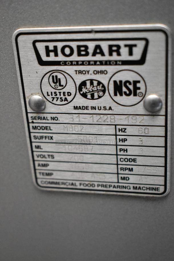 Hobart M802 metal commercial dough mixer label, 200 volts, 3 phase. Includes serial number and manufacturing details.
