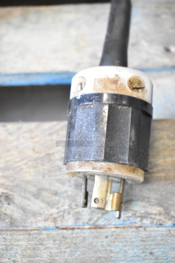 Close-up of the electrical plug for a Hobart M802 commercial mixer, showing signs of wear.