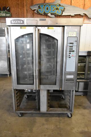 Baxter stainless steel commercial mini rotating rack oven with dual pan rack, natural gas powered, on casters, visible controls.