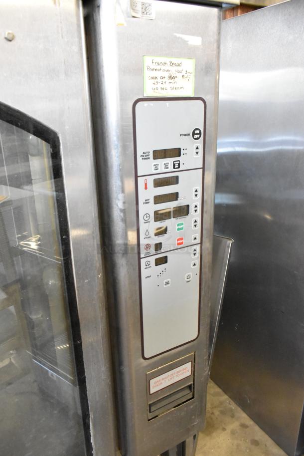 Baxter stainless steel commercial natural gas mini rotating rack oven, dual pan rack, on commercial casters. Control panel close-up.