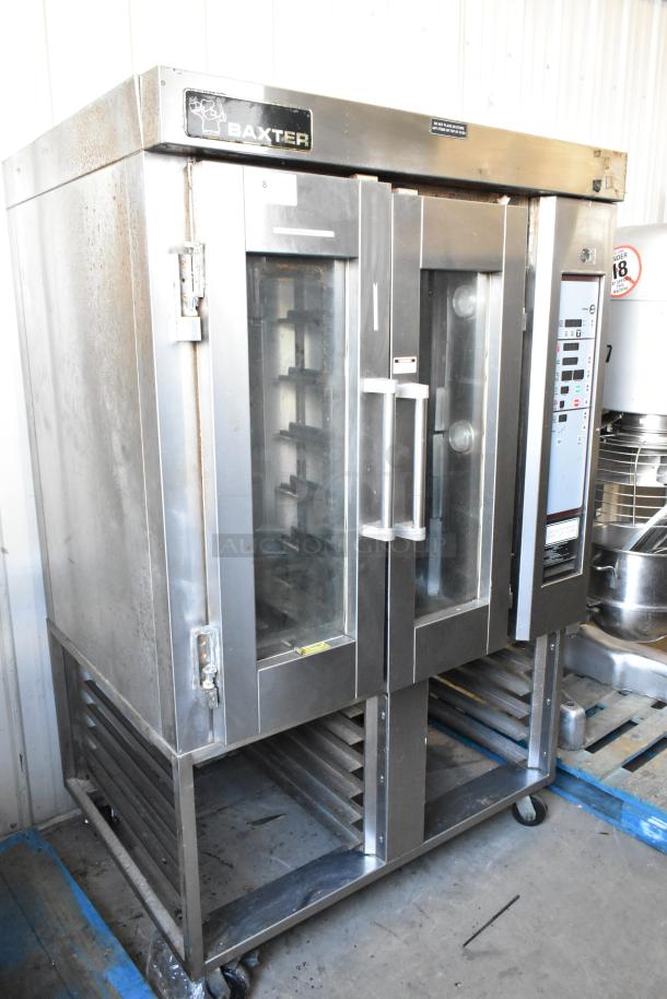 Baxter stainless steel commercial natural gas mini rotating rack oven with dual pan rack, on commercial casters. Visible control panel.