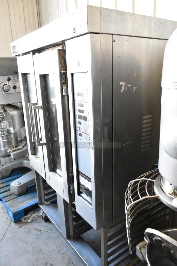 Baxter stainless steel commercial gas mini rotating rack oven with dual pan rack on casters, used condition.
