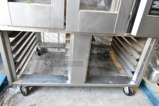 Baxter stainless steel commercial mini rotating rack oven with dual pan rack, natural gas powered, on commercial casters.