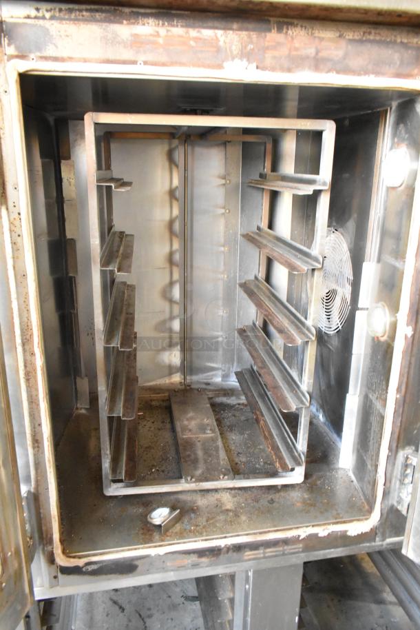 Baxter stainless steel commercial rotating rack oven with dual pan rack, natural gas powered, on casters. Used condition.