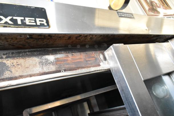 Baxter stainless steel commercial mini rotating rack oven, natural gas powered, with dual pan rack and visible wear.
