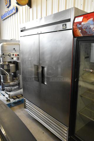 True TS-49 stainless steel 2-door commercial cooler, poly coated racks, on casters, 115V, 1 phase, good condition.