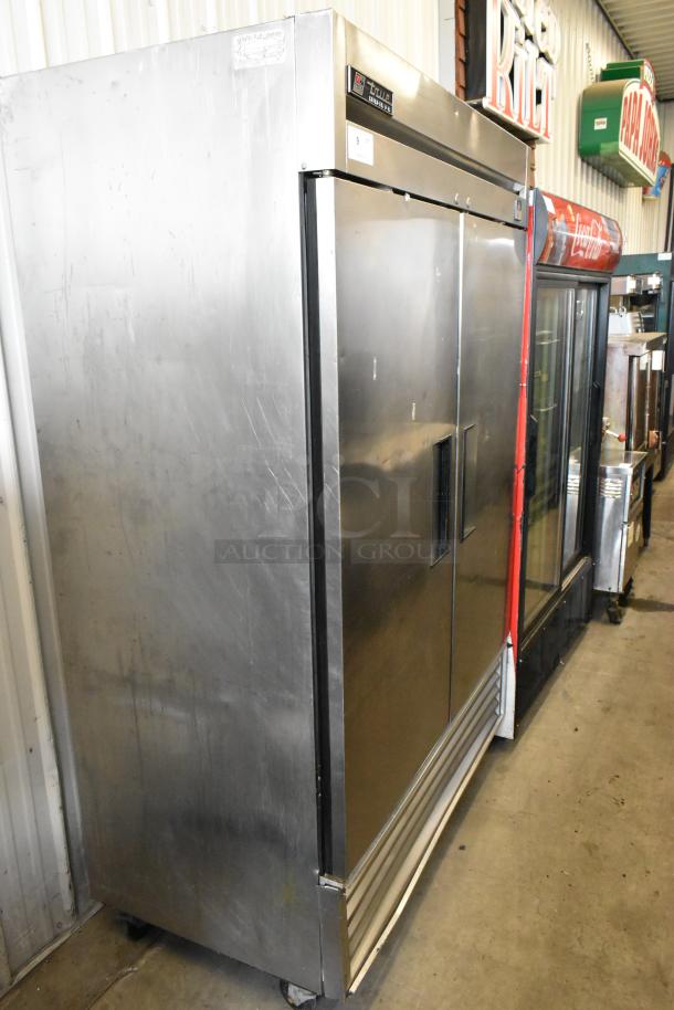 True TS-49 stainless steel commercial 2-door reach-in cooler, features poly-coated racks, on casters, 115V, 1 phase.