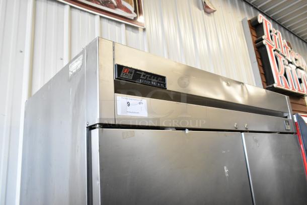 True TS-49 stainless steel commercial 2-door reach-in cooler, poly-coated racks, on commercial casters, 115V, 1 phase.