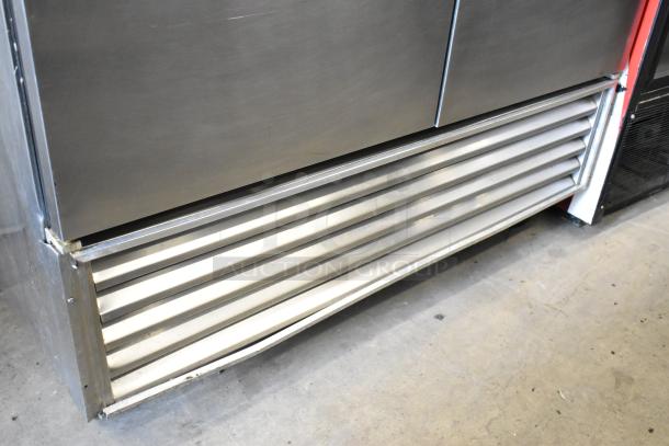True TS-49 Stainless Steel 2-Door Commercial Cooler with poly-coated racks, commercial casters, 115V, 1 phase. Visible lower vent.