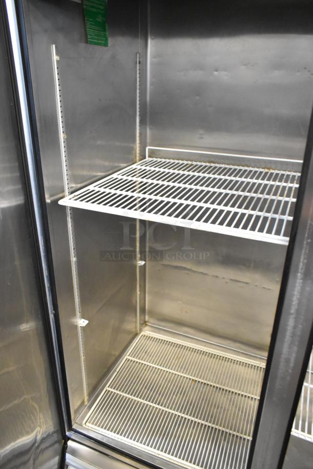 True TS-49 Stainless Steel Commercial 2 Door Cooler, poly coated racks, on casters, 115V, 1 Phase, interior view.