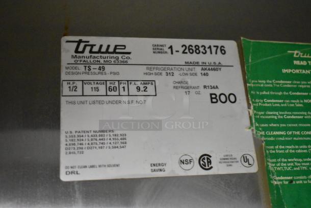 True TS-49 stainless steel commercial cooler model label, showing specs: 115 volts, 1 phase, refrigerant R134A.