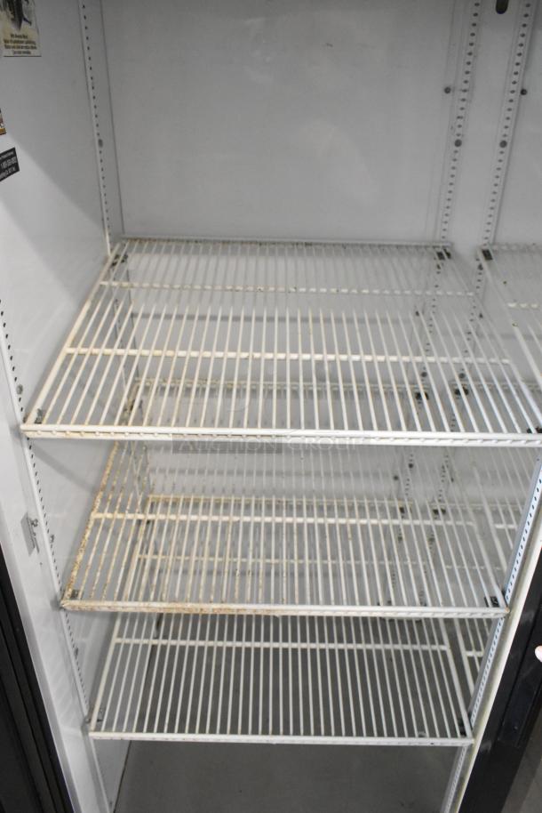 True GDM-45 commercial 2-door cooler, metal finish, poly-coated racks, 115V, 1 Phase, interior view showing racks.