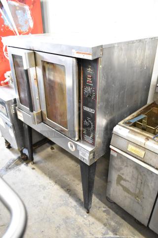 Hobart HGC5-11D3 stainless steel commercial gas convection oven with view-through doors, metal racks, and thermostatic controls.