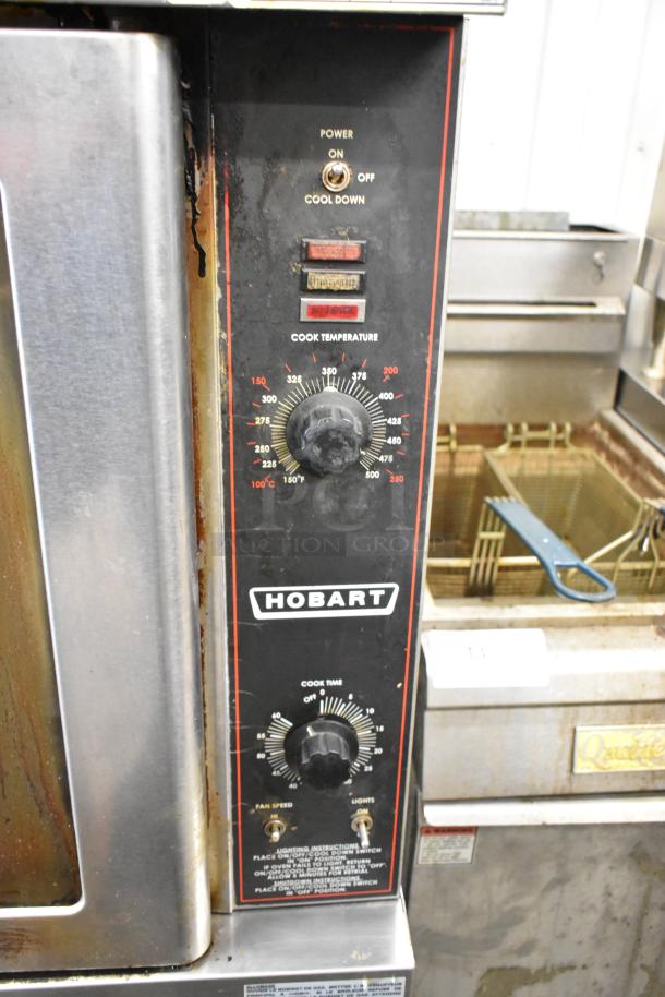 Hobart HGC5-11D3 stainless steel commercial convection oven with view-through doors, thermostatic controls, metal racks.