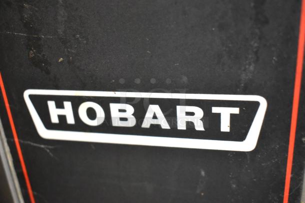Hobart HGC5-11D3 stainless steel commercial gas convection oven with view-through doors, metal racks, and thermostatic controls.