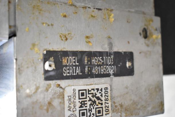 Hobart HGC5-11D3 label showing model and serial number on stainless steel, indicating commercial convection oven details.