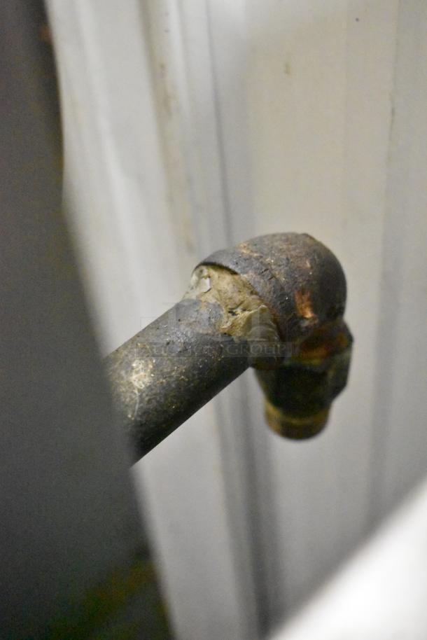 Close-up of a metal pipe with a rusted joint, part of a Hobart HGC5-11D3 convection oven.