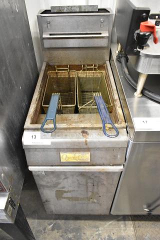Qualite QL-9/NG stainless steel gas fryer, 90,000 BTU, with 2 metal baskets. Commercial floor model, visible wear.