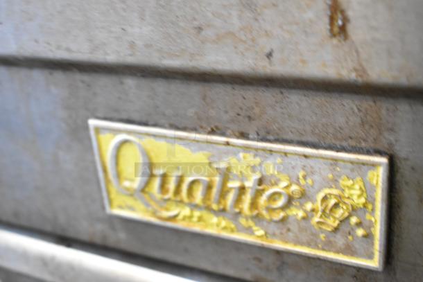 Qualite QL-9/NG commercial stainless steel deep fryer. Visible brand label with wear. Uses natural gas, 90,000 BTU.