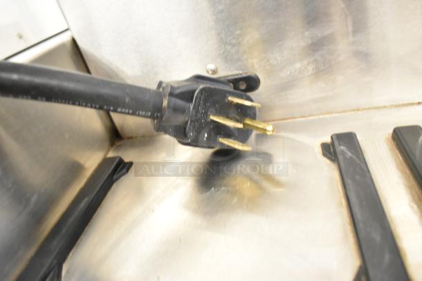 2020 Bunn ICB TWIN SH coffee machine plug detail, showing a 120/208V, 1 Phase setup, stainless steel surface.