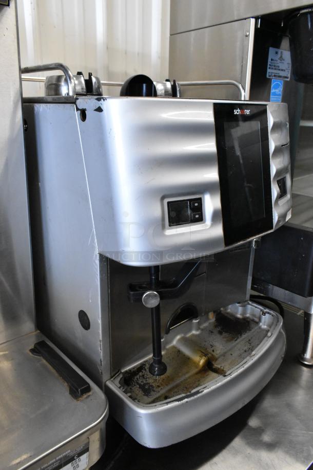 Schaerer commercial automatic espresso machine, metal, countertop design, missing hoppers, 120-208/240V, 1 phase, visible wear.