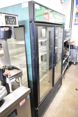 True GEM-49 commercial cooler, 2-door, metal, poly-coated racks, 115V, 1-phase, excellent condition, visible branding.