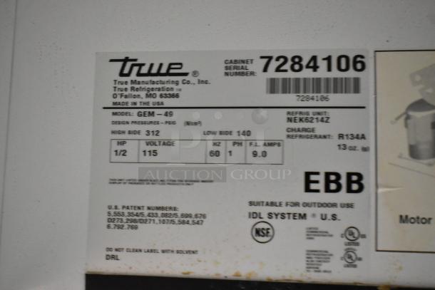 True GEM-49 commercial 2-door cooler label with model details. Features 115 volts, 1 phase. Serial number: 7284106.