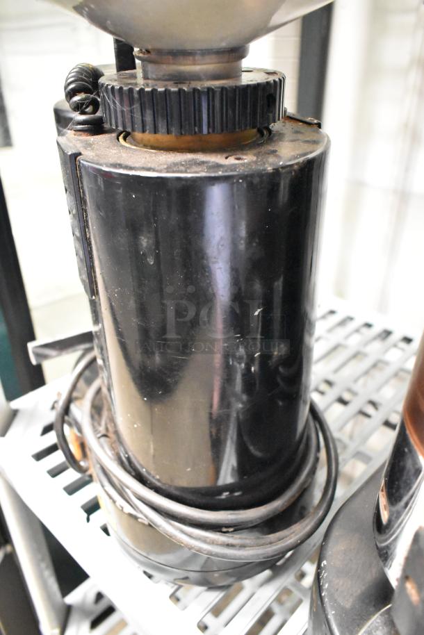 Rossi RR45 metal commercial espresso bean grinder, missing lid, black exterior, 115 volts, 1 phase, visible wear.