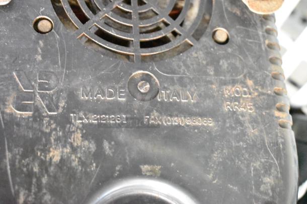 Rossi RR45 espresso bean grinder base showing model and "Made in Italy" markings, slightly worn condition.