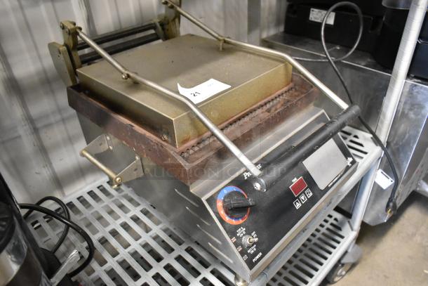 Star CG14IT stainless steel commercial countertop panini press, 120 volts, 1 phase, shown with control panel and grill surface.