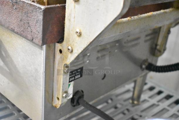 Star CG14IT stainless steel commercial panini press, visible wear, 120V, 1 Phase, label with contact details present.