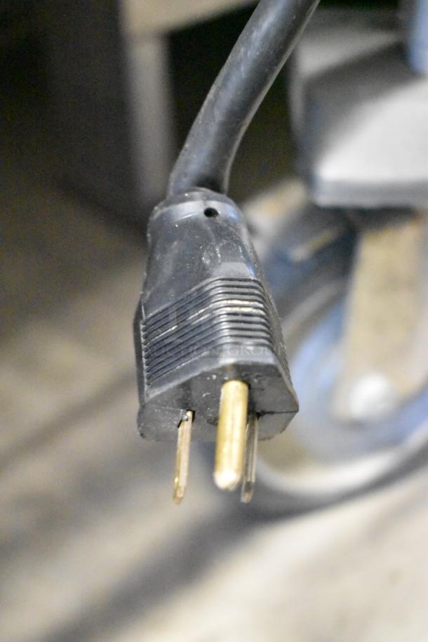 A close-up image of a three-pronged electrical plug for a Star CG14IT Panini Press.