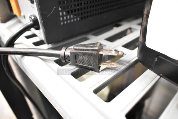 APC UPS and Powervar ABCEG251-11 power conditioner on shelf. Power cord visible. Used condition.