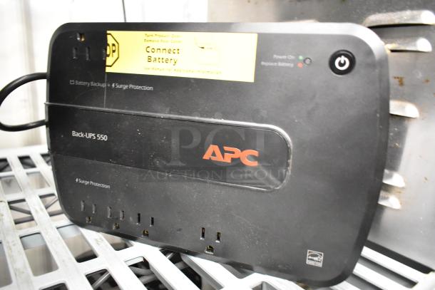 APC Back-UPS 550, uninterruptible power supply with surge protection, power button, and connect battery label visible.