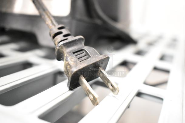 Close-up of a plug for the Hamilton Beach 58159 and Cuisinart SPB-650 blenders, showing wear. 120 volts, 1 phase.