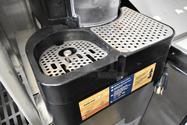 Taylor X83684-12 metal countertop frozen beverage machine, used, visible wear, power cord and operation instructions.