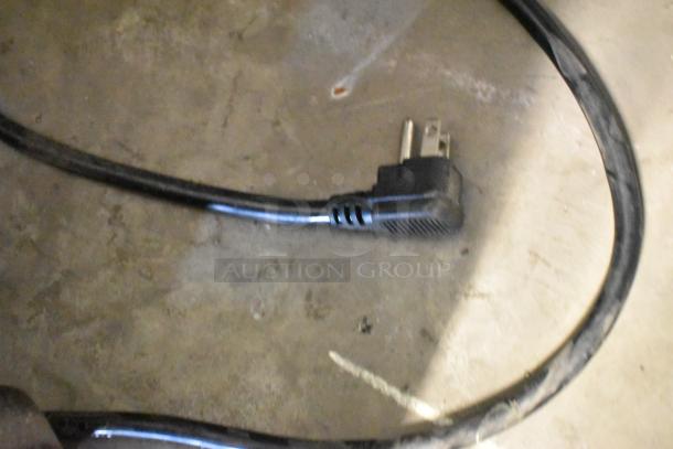 Power cord for Atosa MSF8301 prep table, showing standard plug and durable black casing.