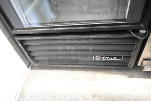 True GEM-26 single door reach-in cooler, metal finish, poly-coated racks, 115V, model label visible, good condition.
