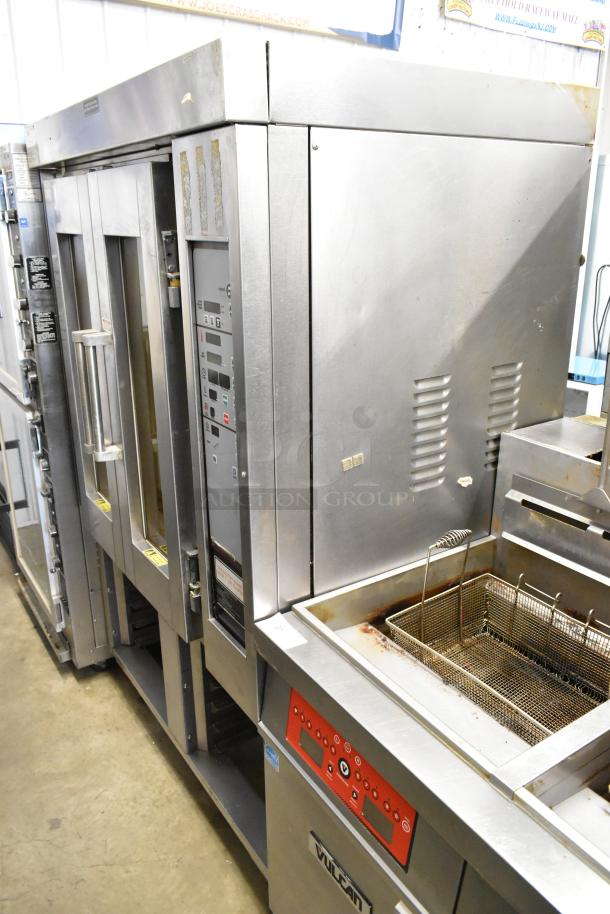 Baxter stainless steel commercial mini rotating rack oven with double pan rack and commercial casters, natural gas powered.