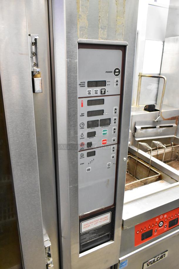 Baxter stainless steel mini rotating rack oven with digital controls, natural gas powered, on double pan rack, with commercial casters.