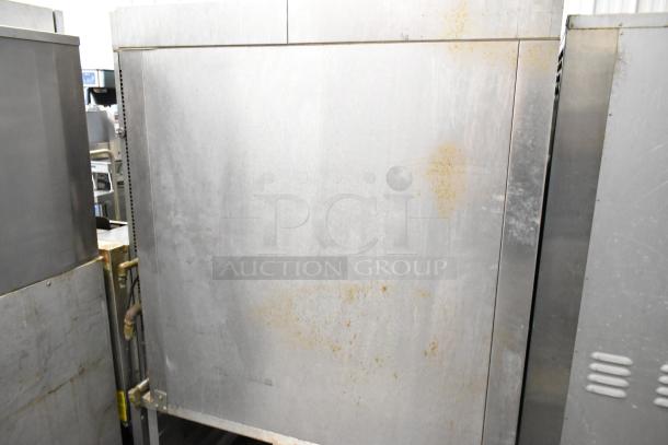 Baxter stainless steel commercial gas mini rotating rack oven on double pan rack with casters; some surface wear visible.