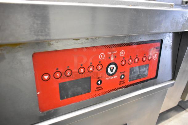 Vulcan 2TR65CF fryer control panel with red display, temperature controls, and program buttons. Stainless steel surface.