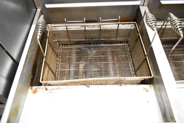 Vulcan 2TR65CF 2 bay, 70 lb capacity deep fat fryer, stainless steel, natural gas, with filtration system, used condition.