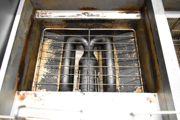 Vulcan 2TR65CF commercial deep fat fryer interior showing heating elements and wear. 70 lb capacity, natural gas powered.