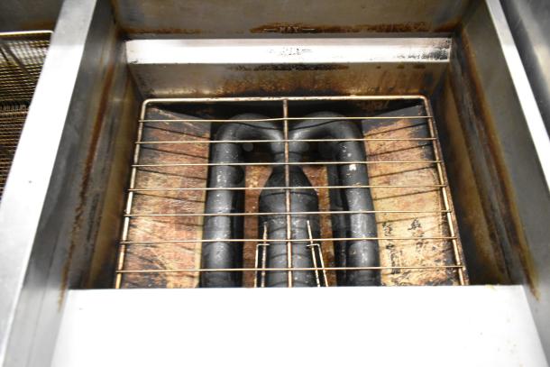 Vulcan 2TR65CF stainless steel deep fat fryer interior view, showing heating elements. Used condition. Natural gas, 70 lb capacity.