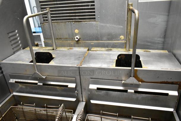 Vulcan 2TR65CF stainless steel natural gas fryer with filtration, 70 lb capacity, 160,000 BTU, on commercial casters.
